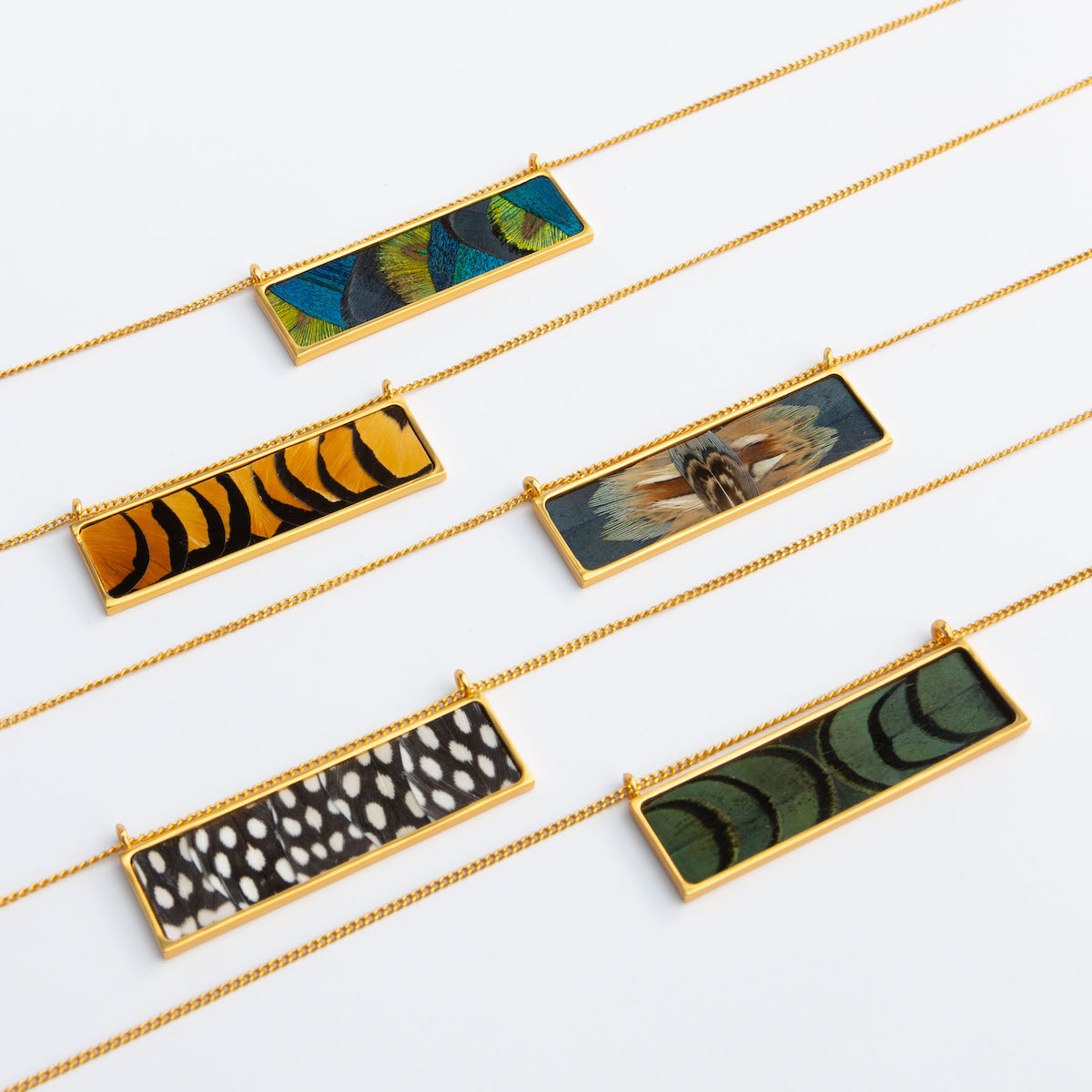 Women's gold necklace collection lifestyle flatlay