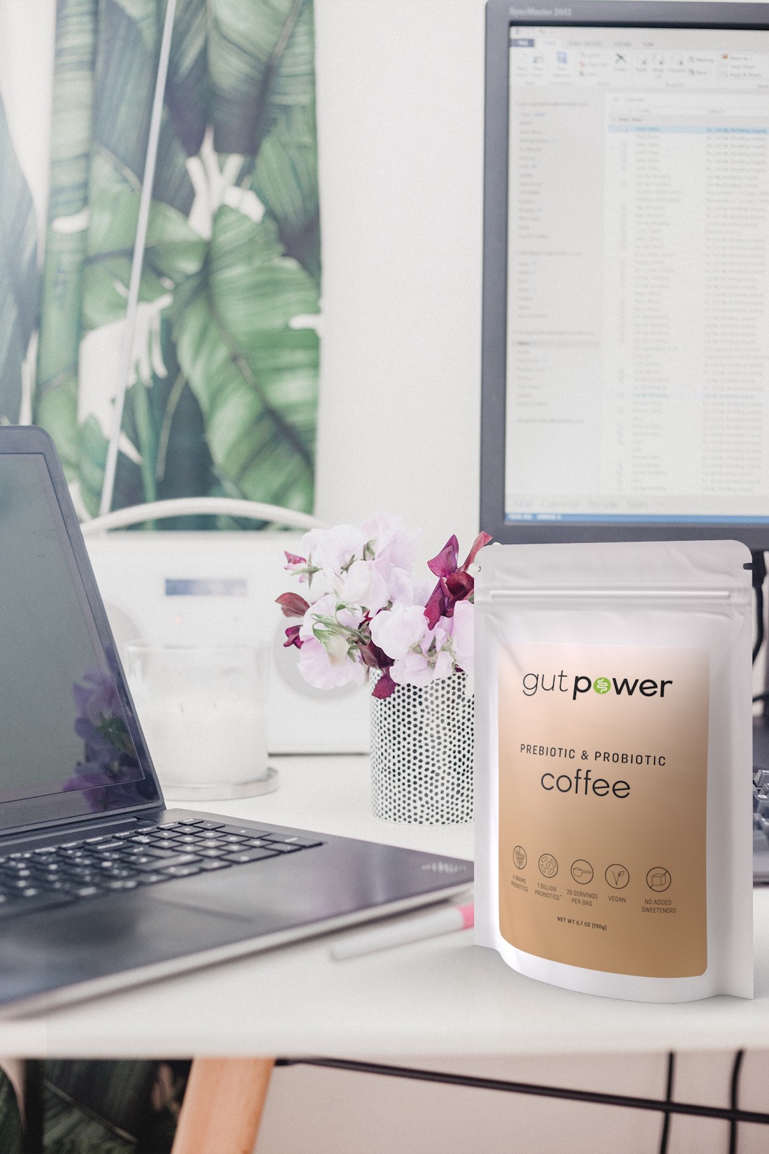 Gut Power Coffee packaging rendered into realistic desk photo.
