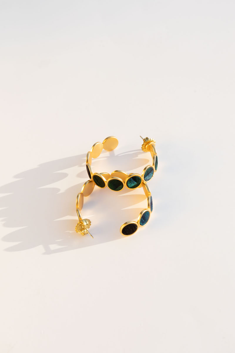 Gold hoop feather earrings lifestyle