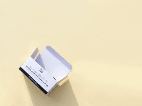 A stop motion gif with mini bath product bottles spilling out of the gift set box.