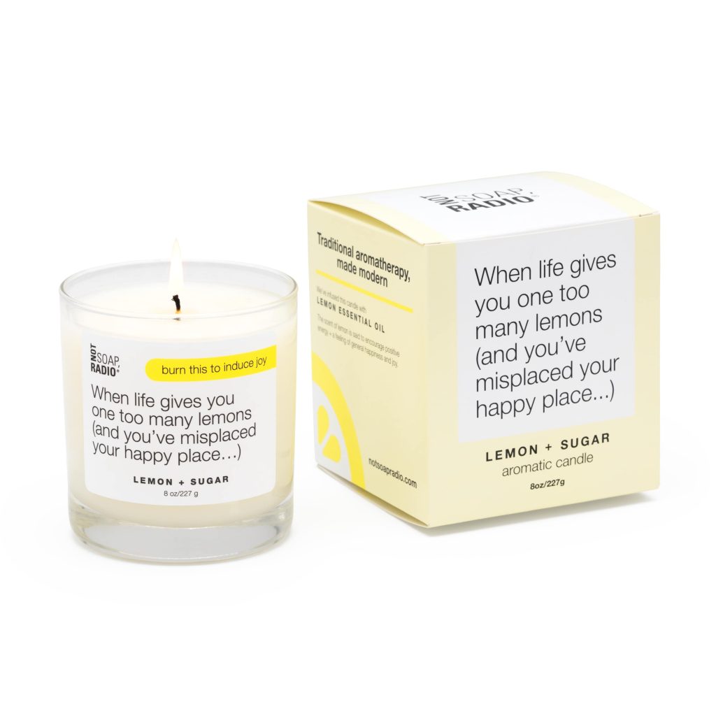 A candle and candle box on a white background.