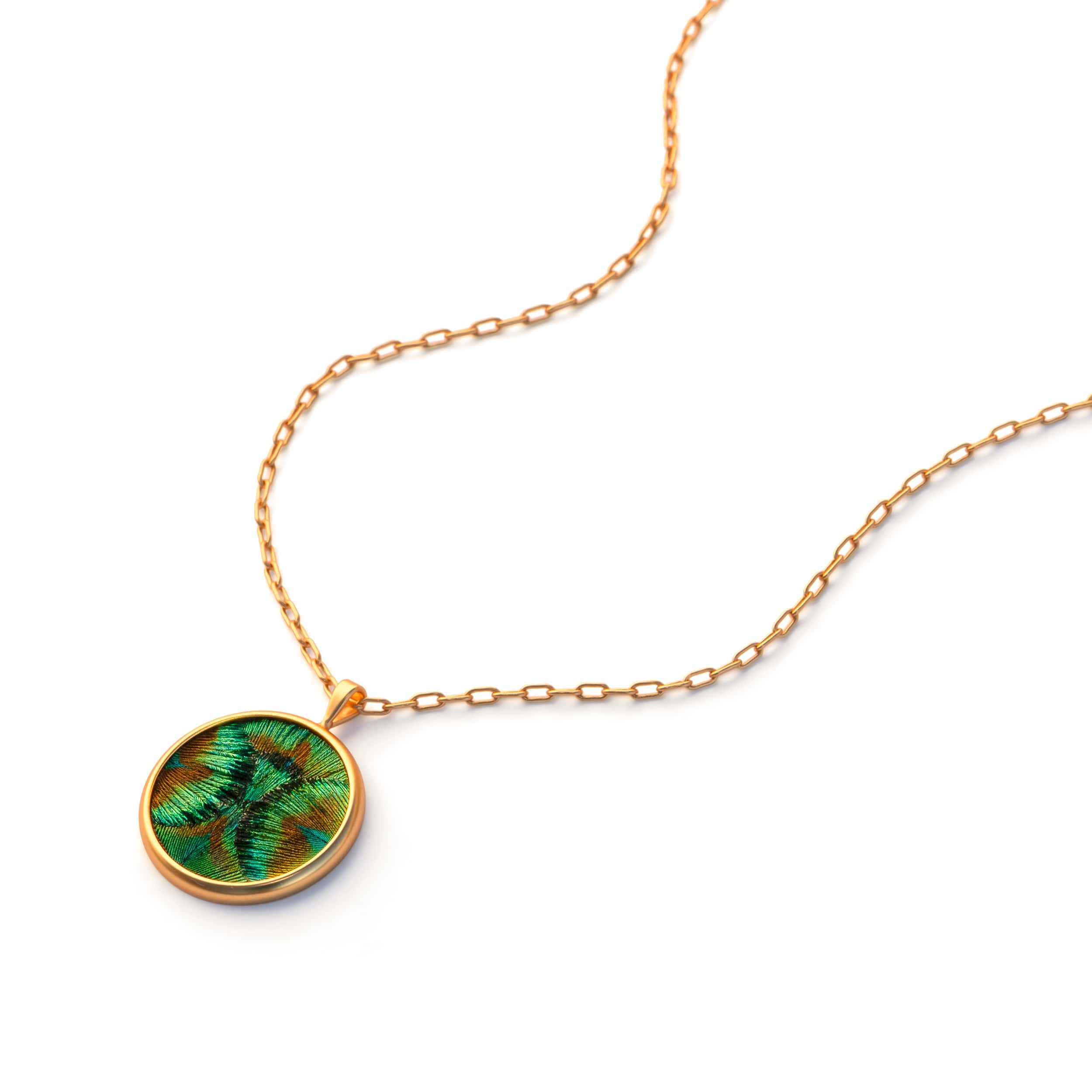 A green feather pendant necklace by Brackish