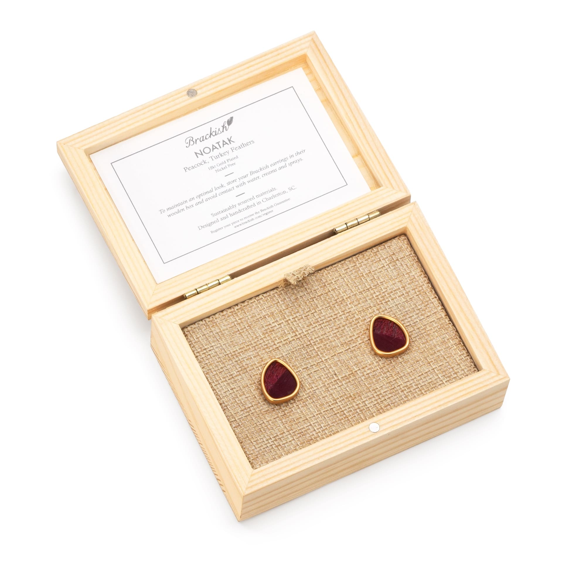 White background product photography for women's Brackish earrings with packaging.