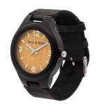 A close up of a men's black wrist watch on a white background.