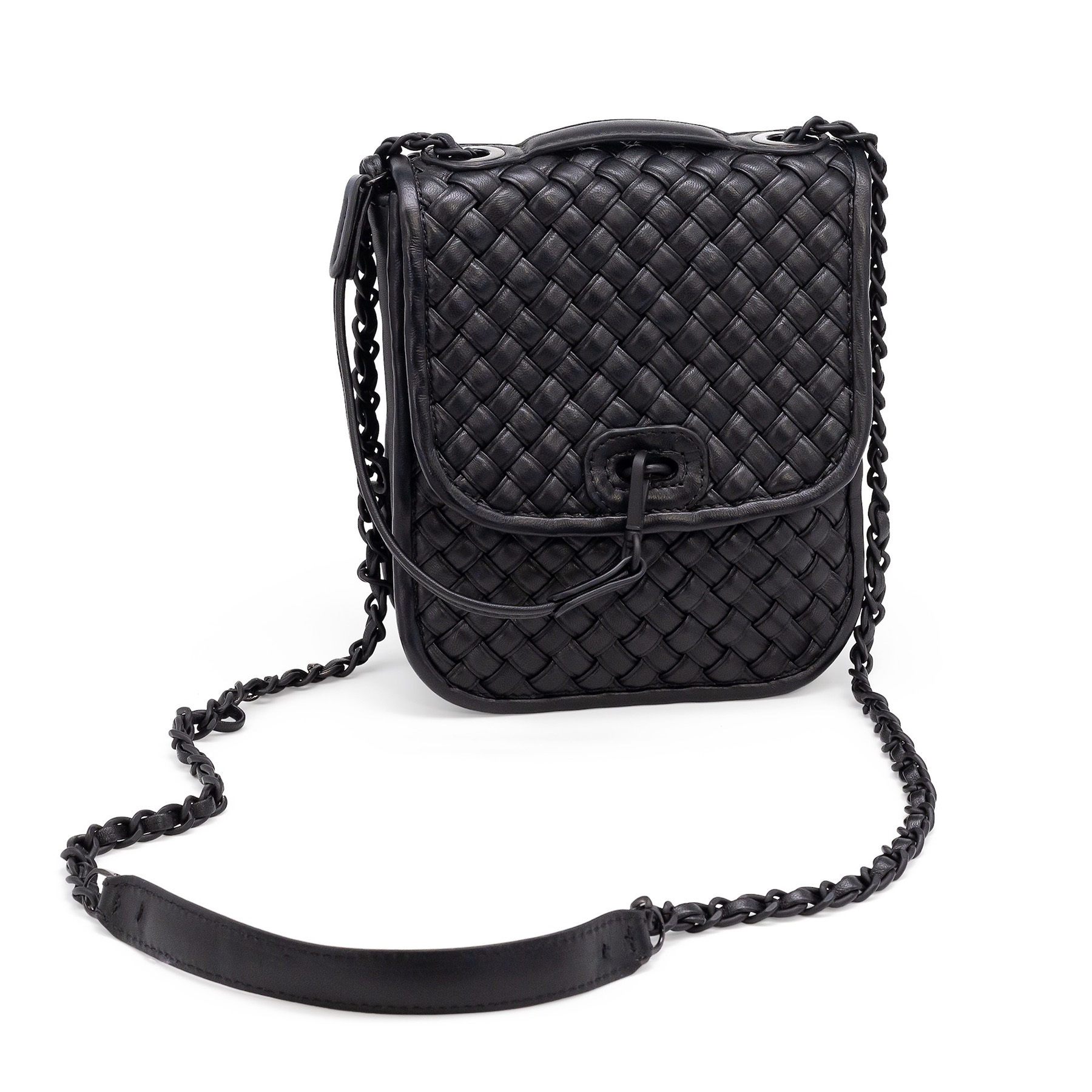 Crossbody purse with chain straps on a white background.