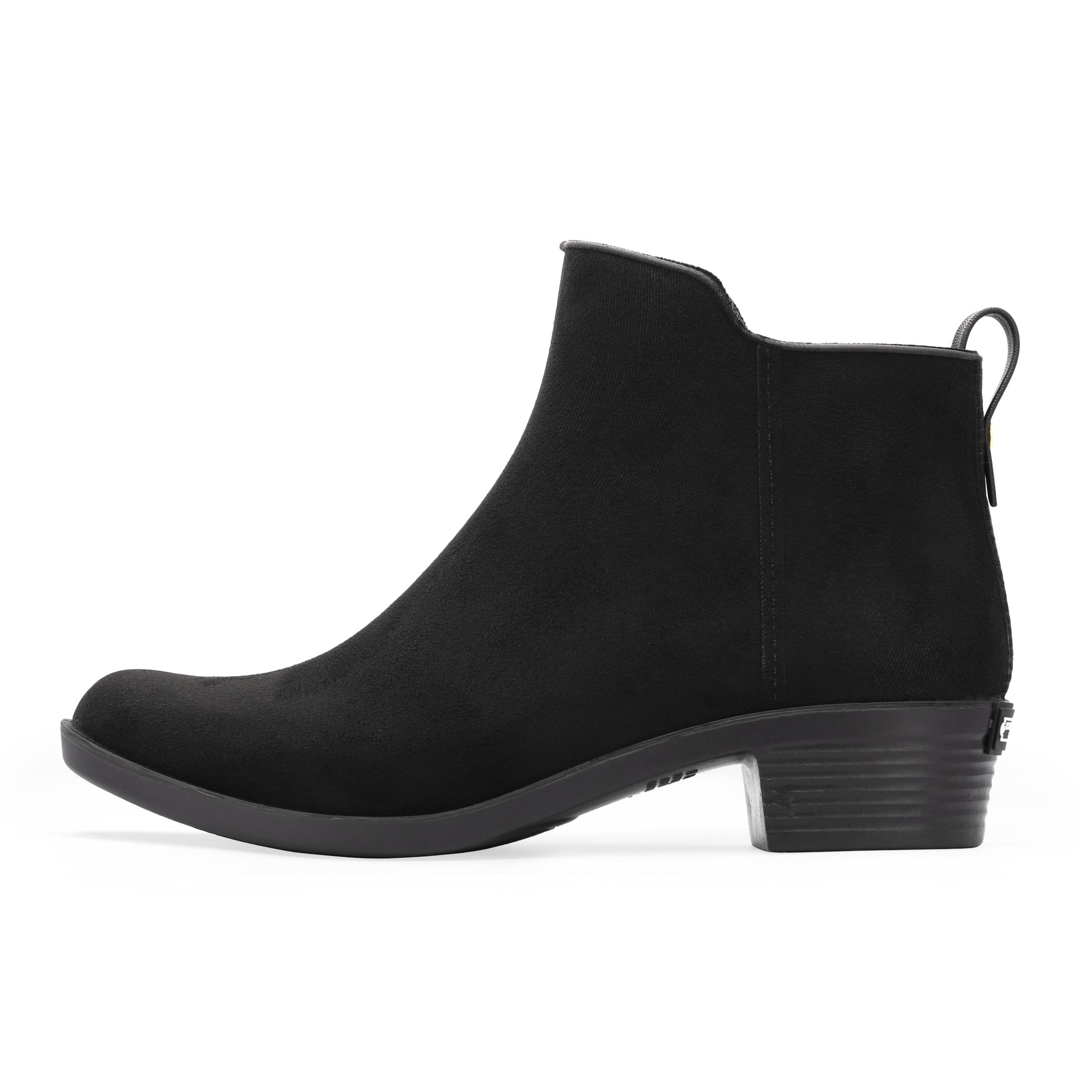 The side angle of a Charleston Shoe black heeled boot.