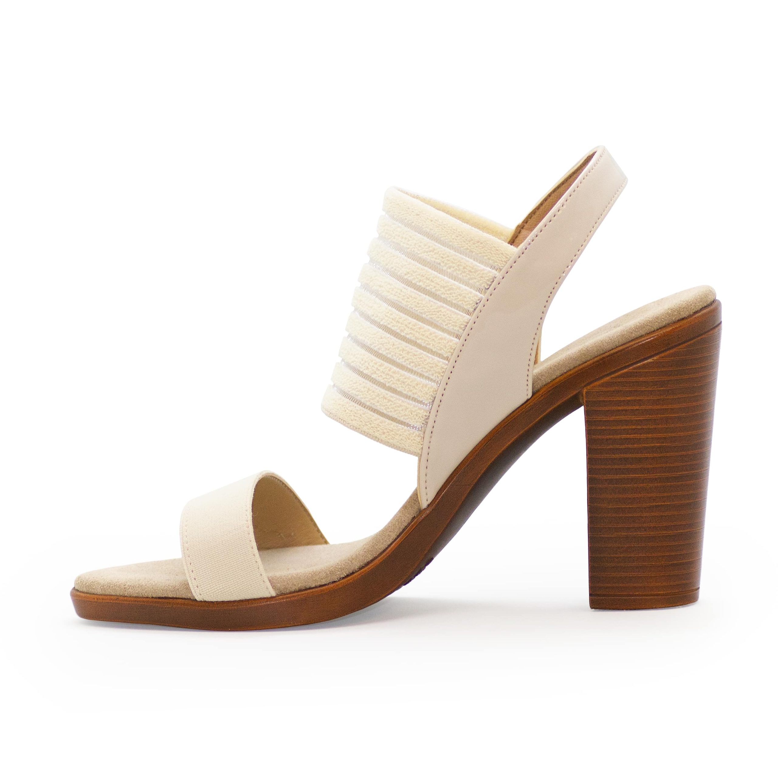 A side angle of a Charleston Shoe Co. women's heeled wedge sandal on a white background.
