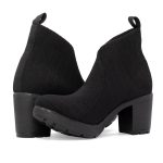 A pair of women's black heeled boots crossing each other on a white background.